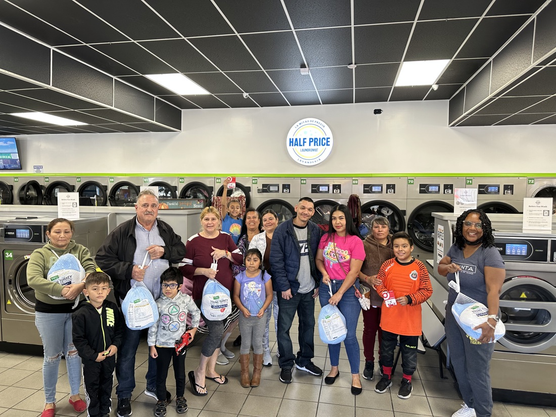 Half Price Laundry customers and team at a community event